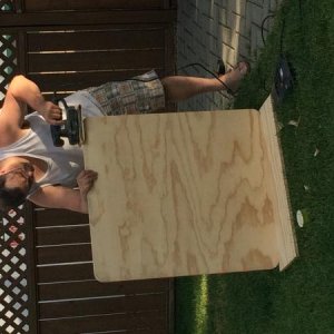 Here's hubby making our new dinette table out of 3/4" plywood.  The dimensions are 32"x36".  There is another 3/4" plywood piece that will stay flat a