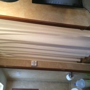 We added a curtain to the bunk.  The fabric is the $1.99/m from Ikea - 60" wide.  I hemmed it short on purpose so a little air could flow through the 