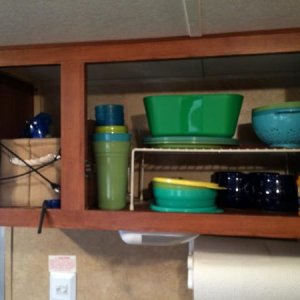 The dish cupboard.  We have a wire Rubbermaid rack to make storage more efficient.  We have the cheap cheap Walmart (do you see a theme? lol) picnic d