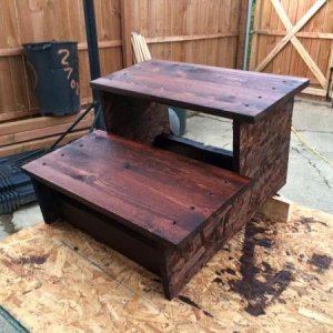 Our old dogs had trouble navigating the metal step on the travel trailer so I made a set of large tread wooden steps.