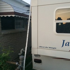 Removing the trim back enough to straighten it out and reseal the panel back to the frame.