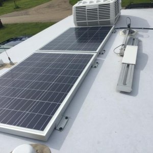 Two 100 watt Polycrystalline solar panels. These are shorter in length which allows them to fit in the limited space along the crown of the roof. Wire