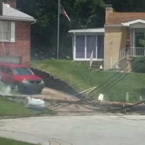 06/19/2017 The utility pole at the street of our former home in Pittsburgh snapped and fell across the driveway into the front yard.  The high-voltage