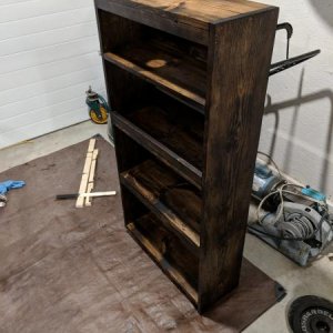 Shelf for bathroom. Hole in the top was to get the bottom screw in for the medicine cabinet.