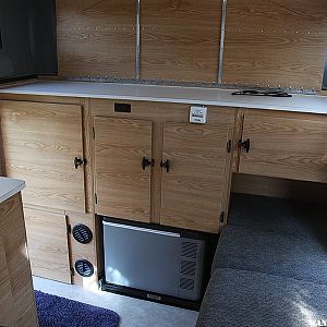 Rear cabinet with recessed Engel fridge