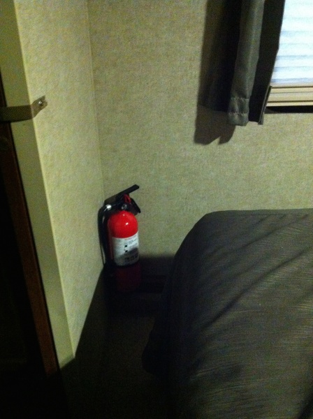 10# fire extinguisher installed in corner of bedroom