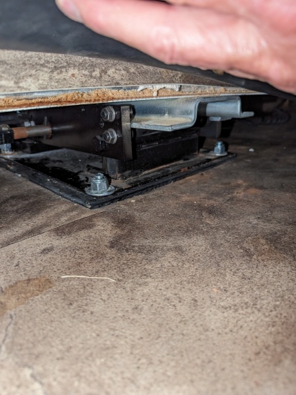 3/8 shim installed under front pad on drivers side slide out due to factory installed with zero clearance at upper forward edge. This caused the seal 