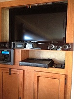 A/V center after moving radio/DVD player to left.  Removed the blanking plates, added a cherry filler to the right of the radio and fill plate to clos