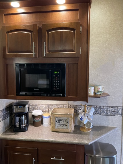 Added a Small Corner Shelf to the Side of the Upper Kitchen Cabinets