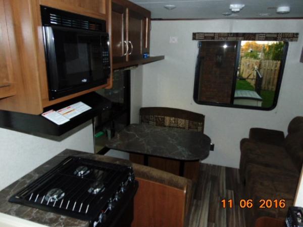 back of the 212 ..... jacknife sofa, nice small dinette, and 2 , no actually 3, nice sized windows to let the outdoors in