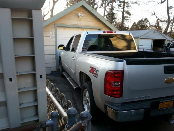 Barely fits in drive, no way she's getting in garage.