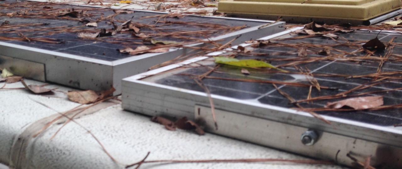 bracket to hold the panel to the roof on previous camper.  bracket is taped with VHB tape, panel bolted to that.