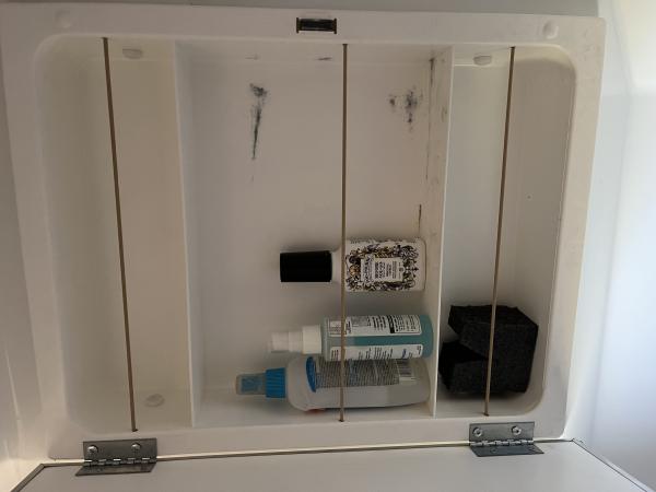 Bungee cords added to medicine cabinet