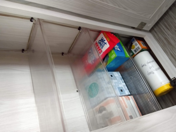 Converted the wardrobe into a pantry space, adding stackable shelves.