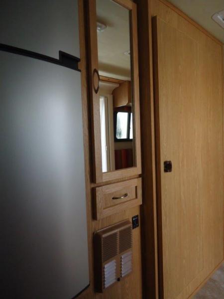 Finished fridge/pantry area - extra drawer under pantry closet to reclaim dead space.