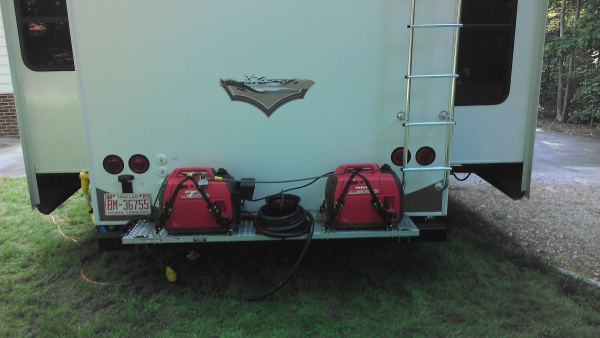 Generator rack...yes I did it. I clamped 2 1x1 pieces of square tubing to the top of each frame extension so that NO weight is on the back bumper. I t