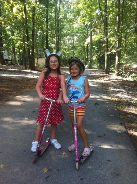 Girls riding scooters