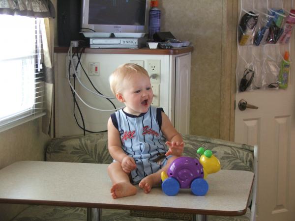 Grandbaby sitting on table "just for picture :>) " inside our Antiqua