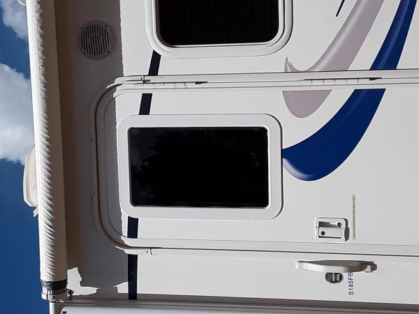 I added this window in the door of my 185fbs.  Newer trailers have this from the factory as standard equipment.  I wanted more natural light in that d