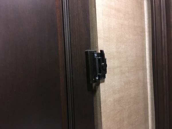 Installed a window latch instead of magnets to hold bedroom door closed while traveling