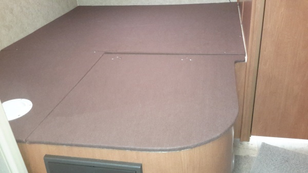 Installled felt covered bed base with storage under queen.