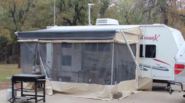 It came with a screened room that had never been used. It had to be fitted to the trailer and awning, but once that was done, set up was pretty easy. 