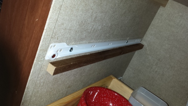 Left drawer slide. Mounted with Toggle Bolts