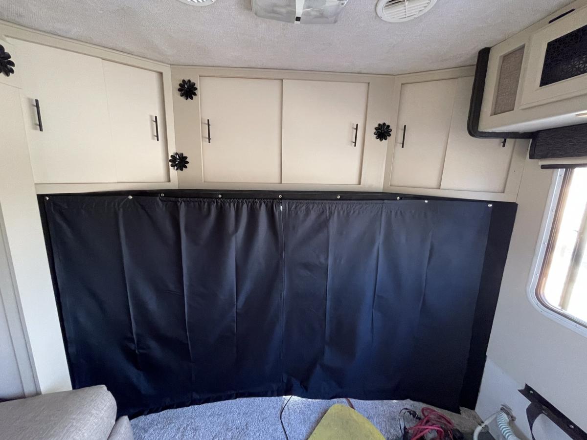 made a triple purpose curtain between cab area and ‘house’ - high quality blackout fabric, adds privacy, blocks light and amazing insulating propertie