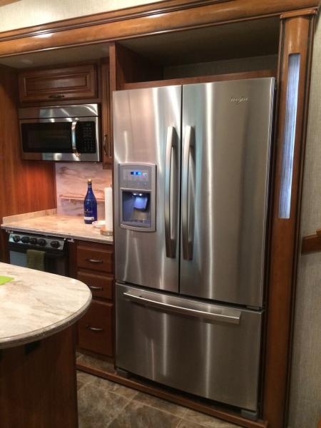 New fridge with new door keeper to keep the doors closed.