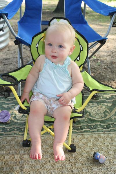 Our granddaughter, learning the fine art of sitting in the shade at camp on a hot afternoon, Memorial Day weekend 2012. (Van Buren S.P.)