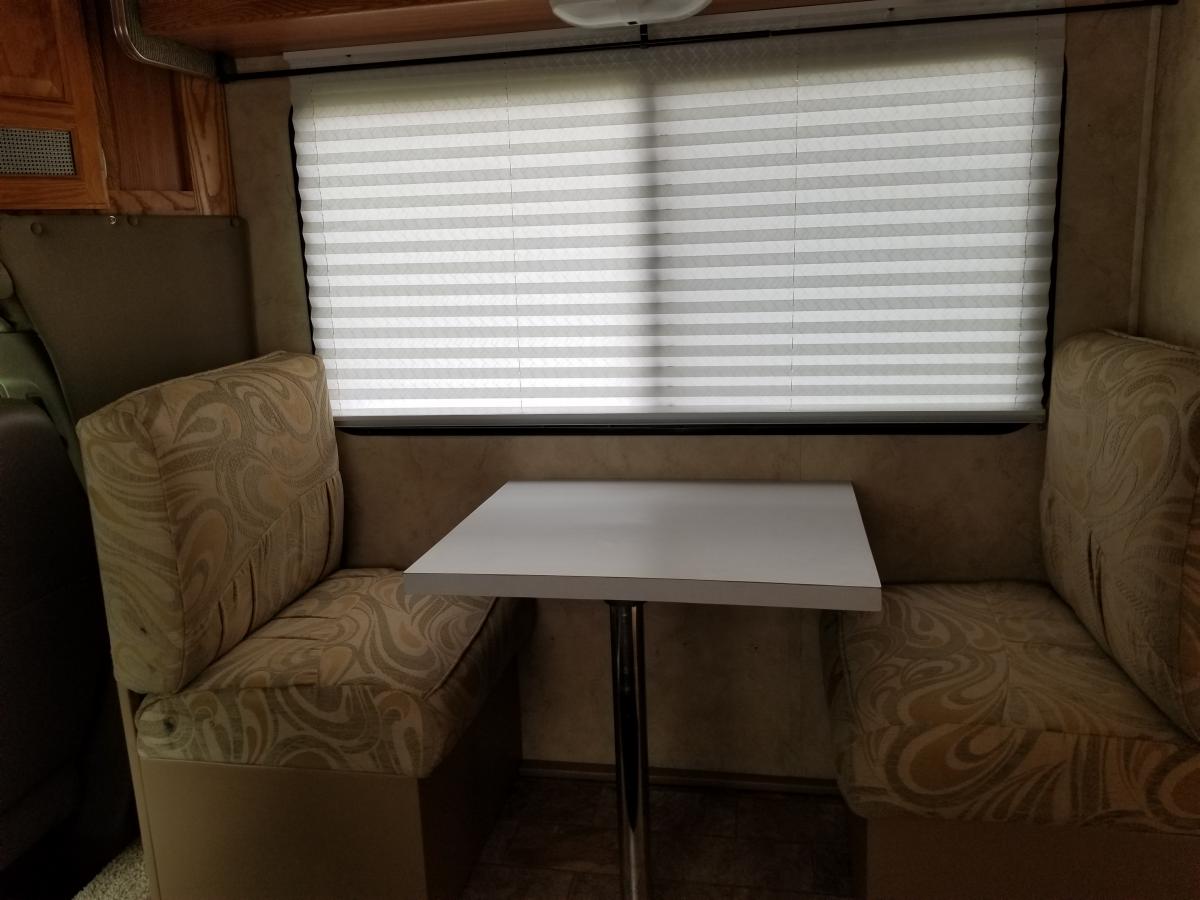 passenger side converted to dinette utilizing cushions from couch (bed)...and building custom box storage underneath...