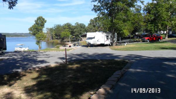 Pull thru site long enough to park the pontoon trailer, the TT, and 2 vehicles. Pulled the boat up to shore beside our site and had small gravel to se