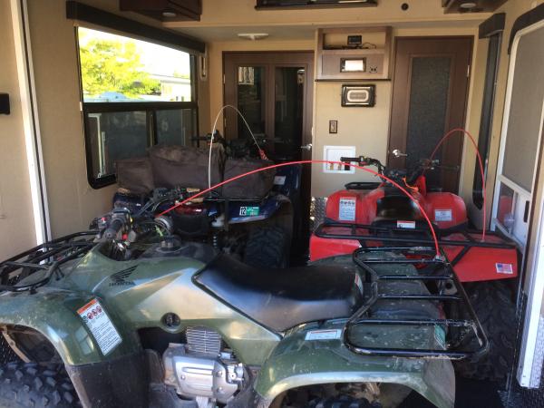 Rancher 420 and two Recon 250s in the garage