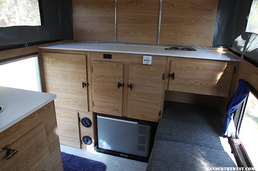 Rear cabinet with recessed Engel fridge