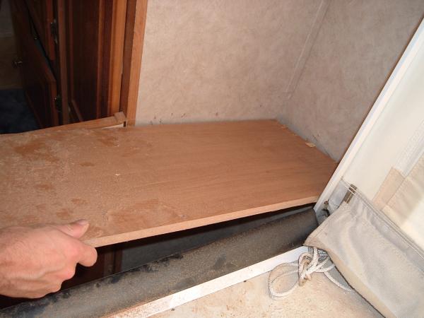 Rear Shelf 6: The other side of the shelf was easier to remove as the shower wall was no longer an obstacle (due to staples).