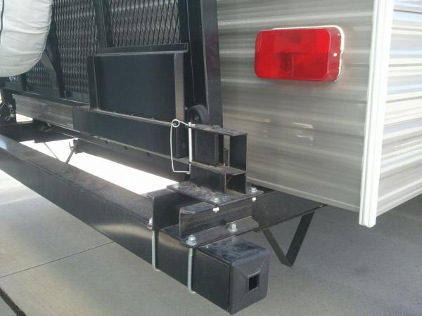 RVQ grill swing arm with a modified way of mounting it so I could place it in the stored position with the rear rack up or down