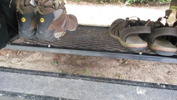 shoe rack keeps dirty shoes outside but off the ground