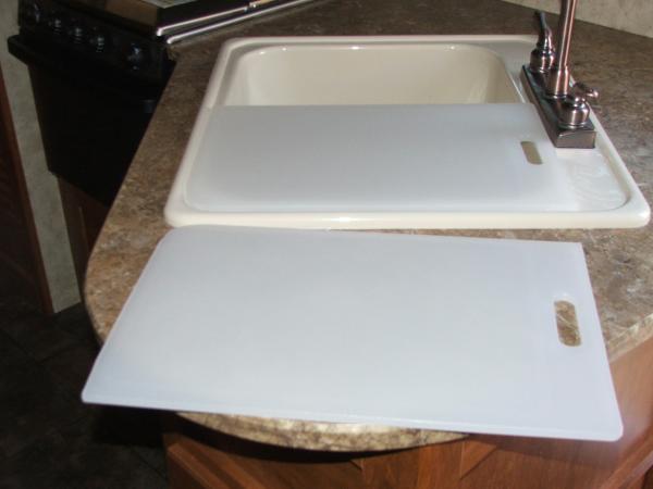 Sink covers my husband made out of cutting boards to fit sink. I had one big one for big sink but  I wanted two. Under the one on sink I like to keep 