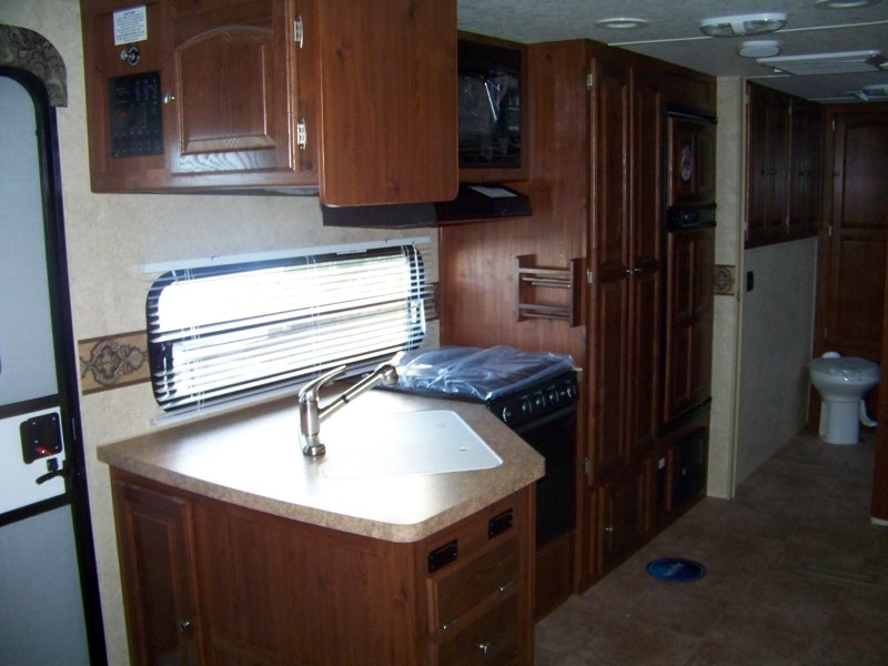 Sink, Pantry, Fridge and Doorway to Bathroom