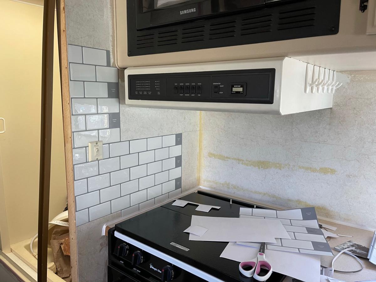 Start of the subway tile in the kitchen