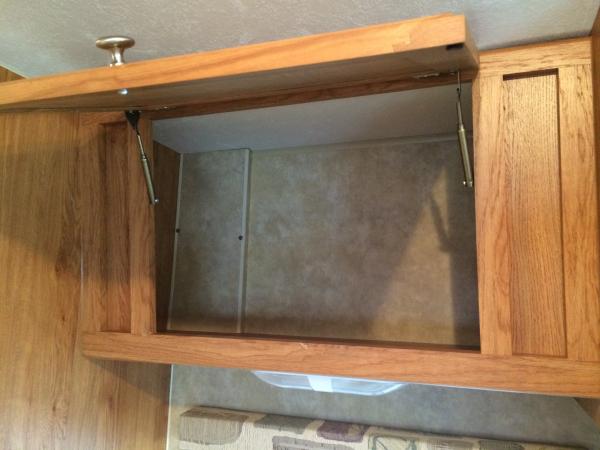 The cabinet above the sink is tapered and a large space leaving dishes stacked and always a mess. So we decided to add a shelf to divide the space.