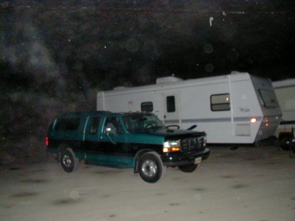 The Eagle 266 FBS parked in an underground limestone mine for the winter with the 96 Ford F-250 parked next to it.  The marker lights are not on, it's