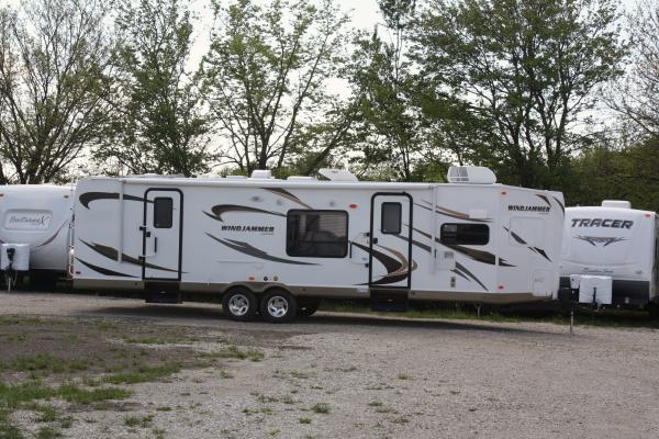 There she is!  Our first sighting of our first TT, on the lot at Wana RV, Shipshewana, IN, fresh from the factory on 5/8/2012.  Sweet!