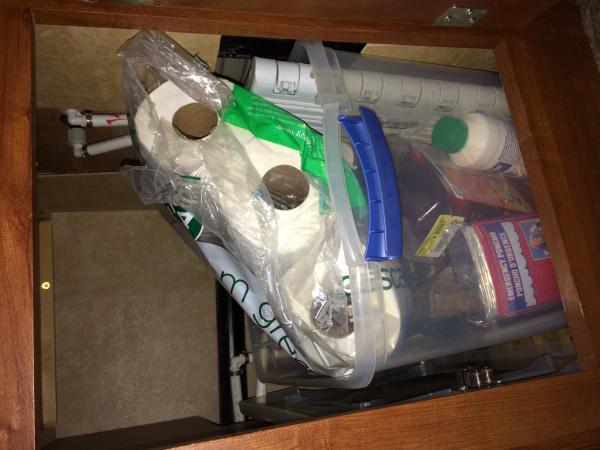 This is the cupboard under the pantry.  We store toilet chemicals, toilet paper and a few other things we don't reach for all that often.  A Sterlite 