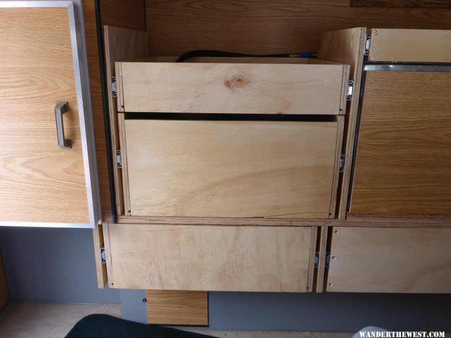 Three right hand drawers. Propane box on right with silverware drawer on top of propane box