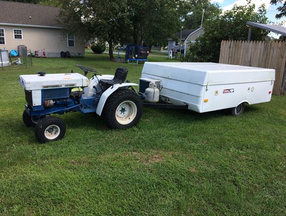 Tractor and 1986 Coleman Laramie