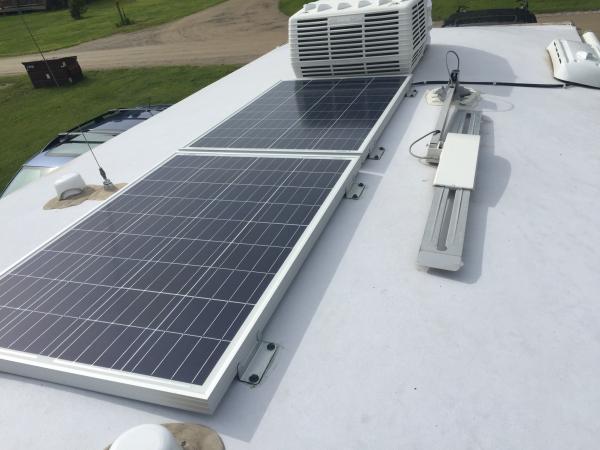 Two 100 watt Polycrystalline solar panels. These are shorter in length which allows them to fit in the limited space along the crown of the roof. Wire