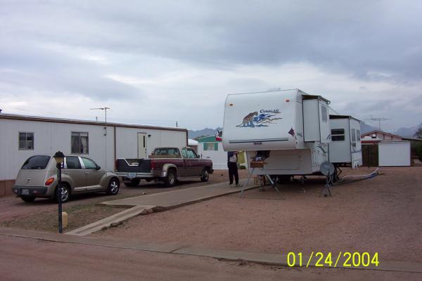 Visiting my parents in Apache Junction in 2004. That's my wife's PT Cruiser and dad's 1991 Dodge Ram D350 and Cougar 5th wheel. FYI they still have th