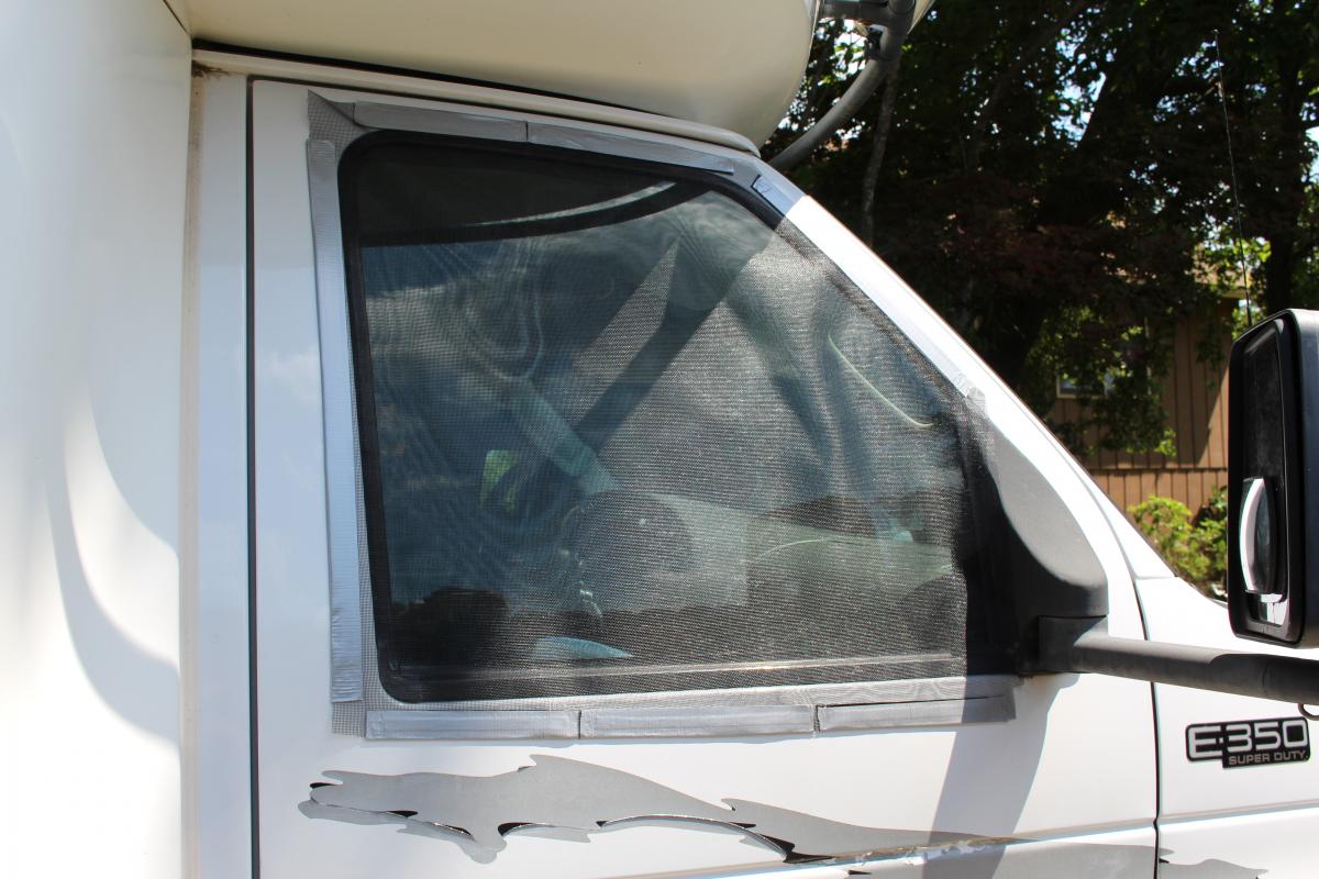 Wanted to be able to open cab window with out the bugs getting in. Screen and magnetic tape.