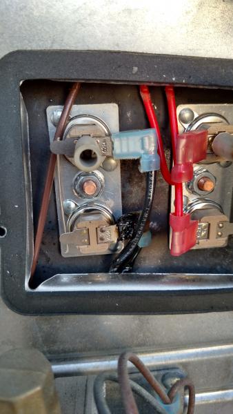 Water Heater thermostats showing wiring indention's from cover and metal edges